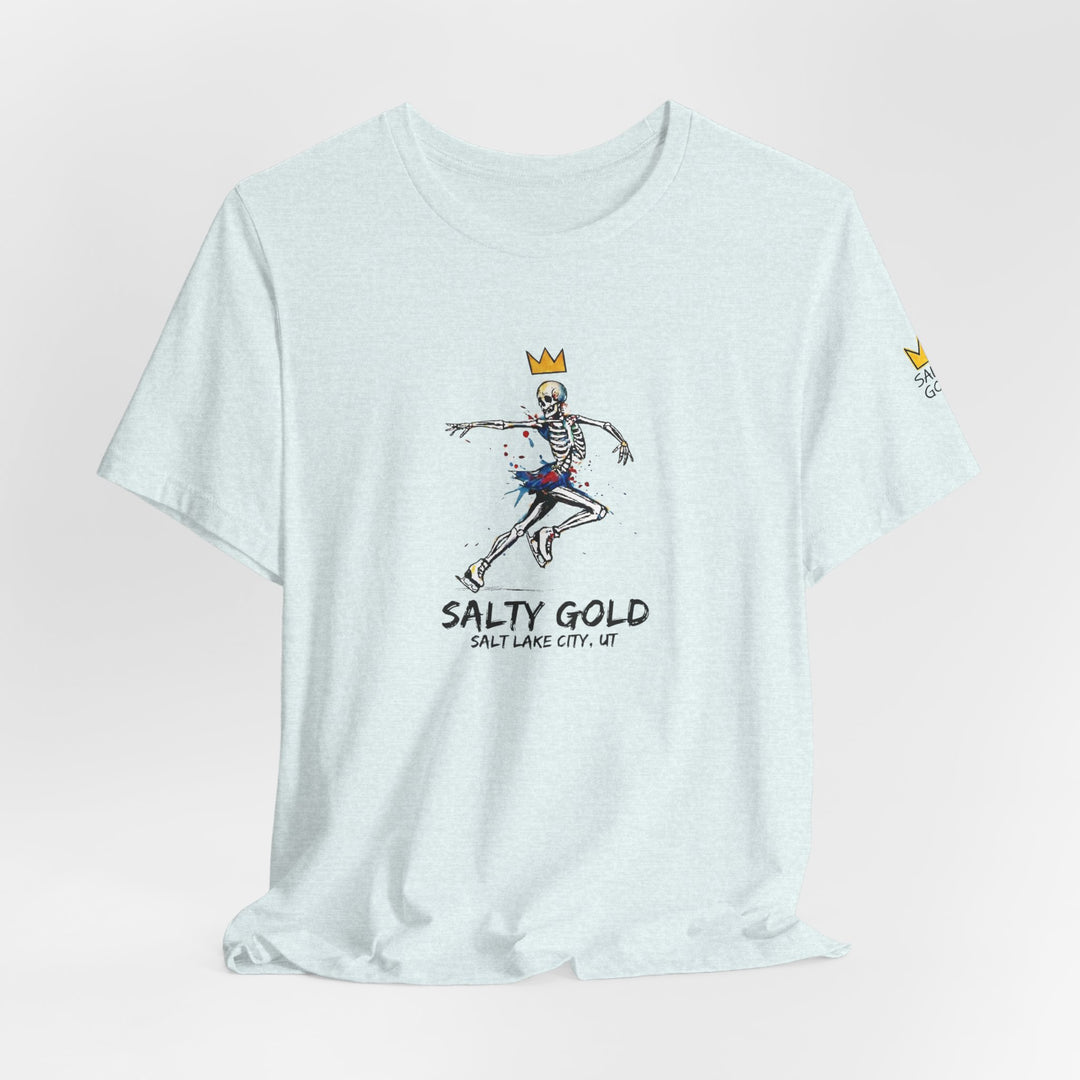 Salty Gold light blue skeleton figure skating tee. Graphic features crown, colorful paint splatters.