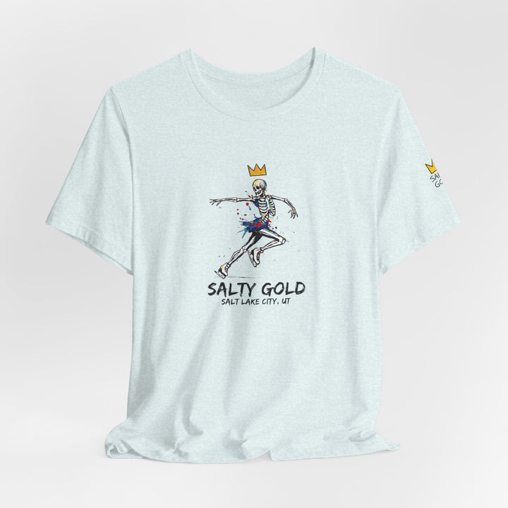 Salty Gold light blue skeleton figure skating tee. Graphic features crown, colorful paint splatters.