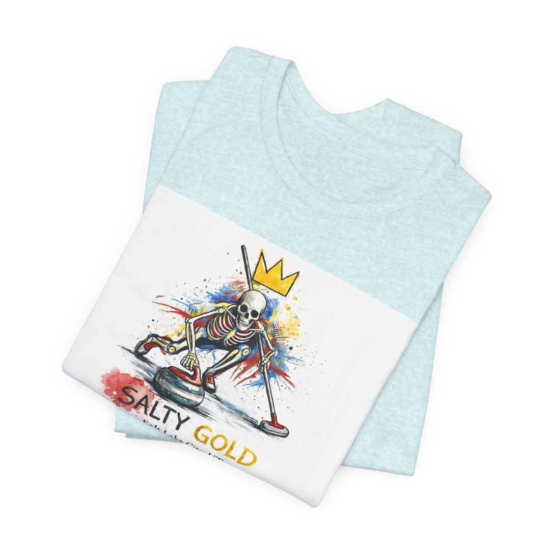 Salty Gold Skeleton Curling Tee. Light blue shirt with white graphic of crowned skeleton sweeping a curling stone.