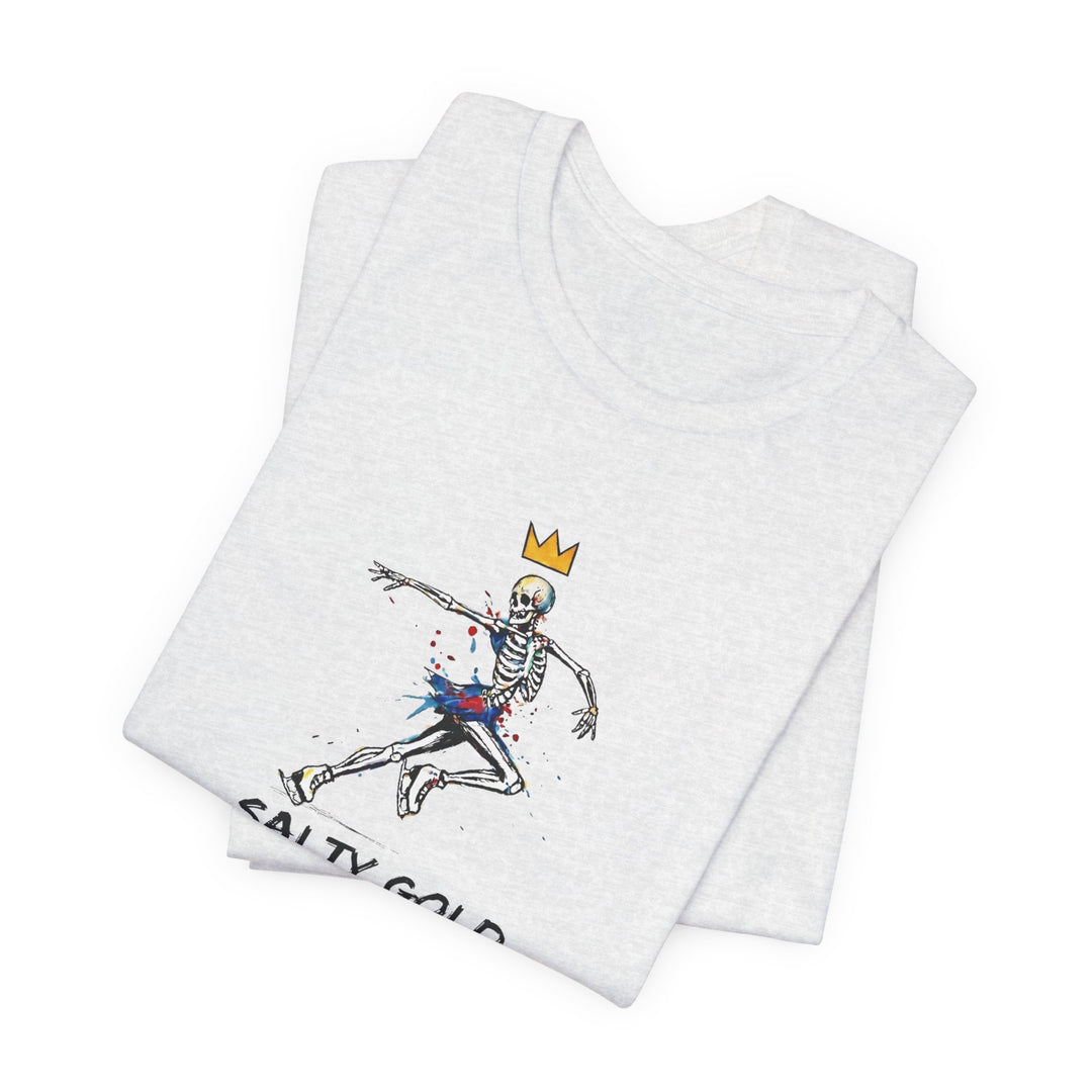 Light grey Salty Gold t-shirt featuring a colorful skeleton figure skating with a gold crown.