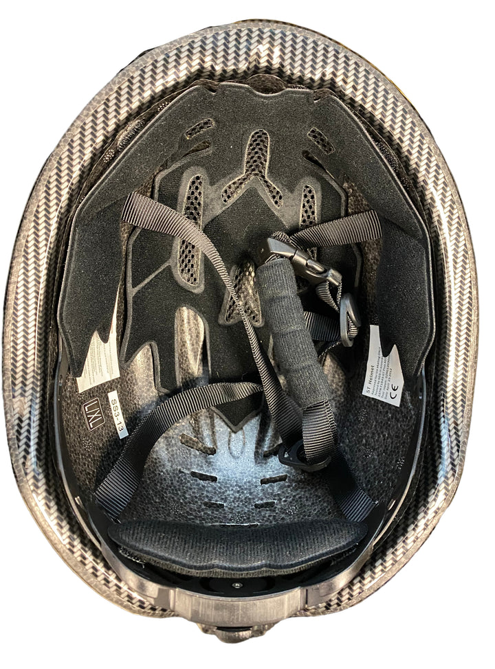 Black Consignment Skate Tech Helmet (L/XL) with carbon fiber shell, interior padding, and black straps.